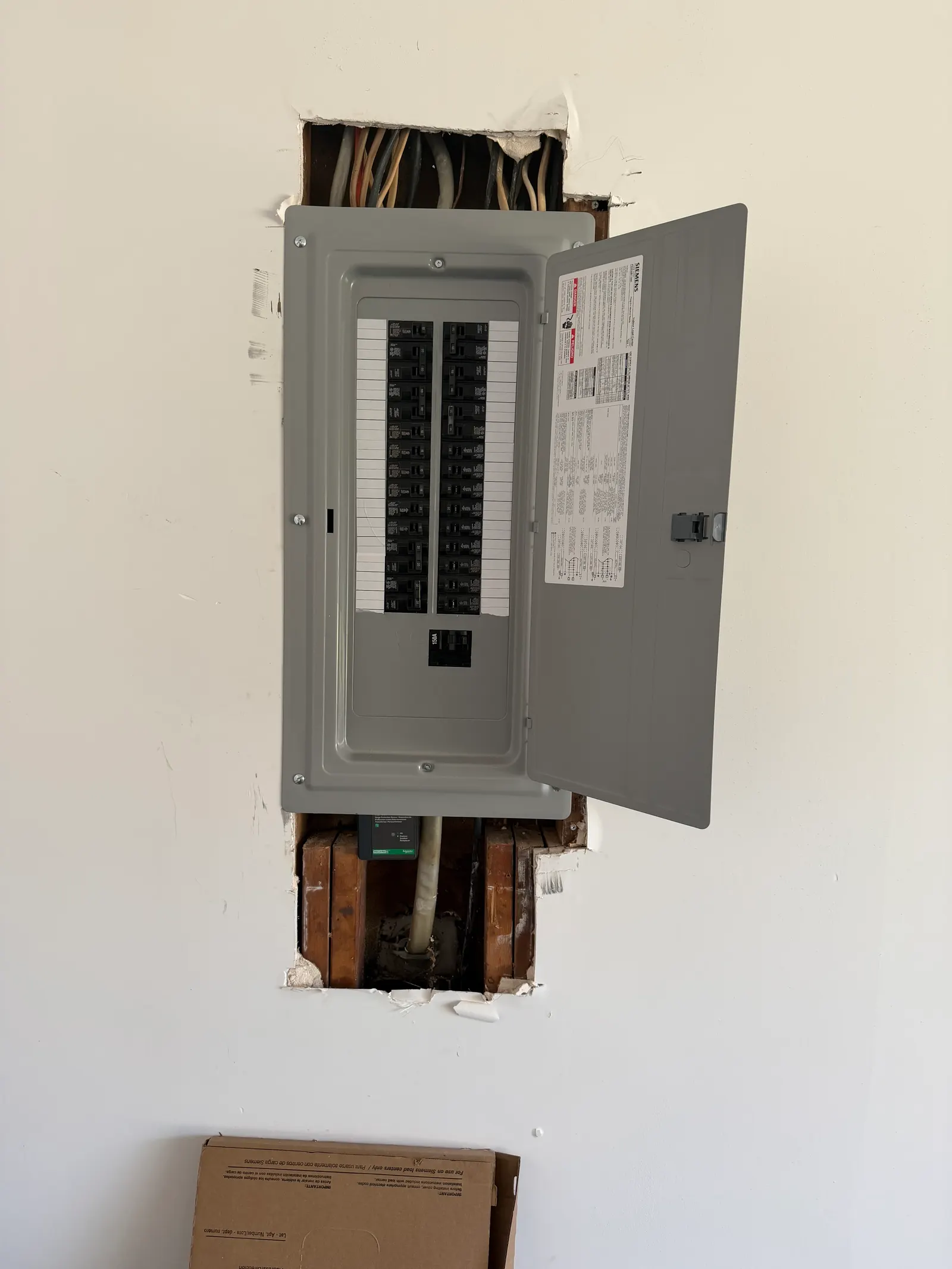 New covered electrical panel with labeled breakers in a Marietta home